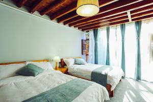 Postel nebo postele na pokoji v ubytování Log Cabin