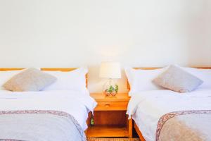 Postel nebo postele na pokoji v ubytování Log Cabin