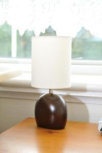 a black lamp sitting on top of a table at Balmoral Guest House in Darlington