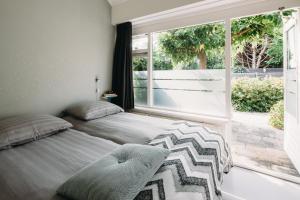 Ένα ή περισσότερα κρεβάτια σε δωμάτιο στο Kranenbergh Boutique Apartments