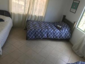 Postel nebo postele na pokoji v ubytování Hostal Casa Lantana