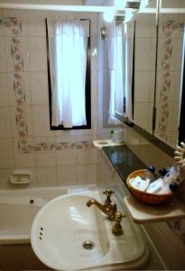 Koupelna v ubytování Primacy Apart Hotel