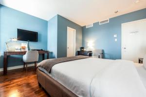 Postel nebo postele na pokoji v ubytování Auberge de La Fontaine