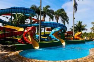a water park with a water slide at Aldeia das Águas Park Resort - Flat Quartier in Barra do Piraí