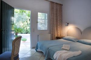 Ένα ή περισσότερα κρεβάτια σε δωμάτιο στο Rododafni Bay Residences