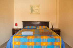 Ένα ή περισσότερα κρεβάτια σε δωμάτιο στο The Cottages by the Sea