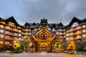 a large building with a clock on the top of it at One Ski Hill, A RockResort in Breckenridge