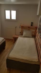 a bedroom with a large bed in a room at Apartment Heiko in Strömsberg