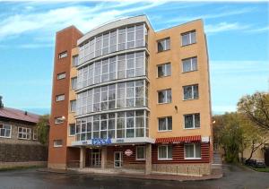 a tall building with a lot of windows at Tessa Hotel in Yekaterinburg