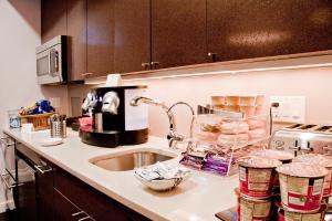 a kitchen with a sink and a counter top at Inn at St. Botolph in Boston