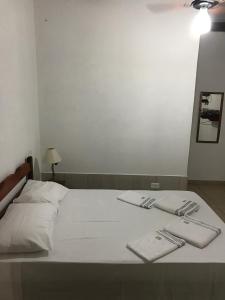Katil atau katil-katil dalam bilik di Pousada Recanto das pedras