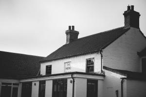 a black and white photo of a building at The Hero in Burnham Market