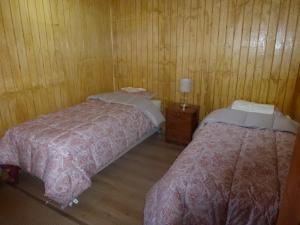En eller flere senge i et værelse på Cabanas los picaflores