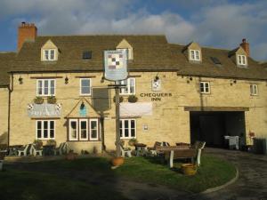 a large stone building with at The Chequers Inn in Oxford