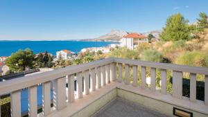 a balcony with a view of the water at Luxury Residence Omis in Omiš