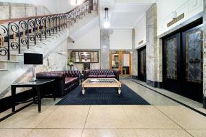 a living room with a couch and a coffee table at ULTIQA Rothbury Hotel in Brisbane