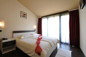 Postel nebo postele na pokoji v ubytování Hotel Fontana