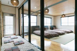 Postel nebo postele na pokoji v ubytování Okinawa Naha Nishi