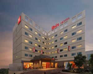a hotel building with a tilts hotel sign on it at ibis Pune Hinjewadi - An Accor Brand in Pune