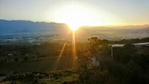 a view of the sun setting over a city at Sun Moon Star in Xinshe