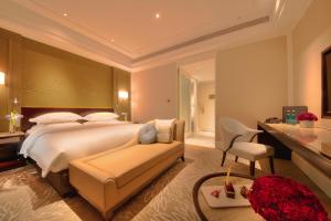 Krevet ili kreveti u jedinici u okviru objekta Wen Ling International Hotel
