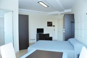 Hotel-Residence-b&b Le Dune beach service included客房内的一张或多张床位