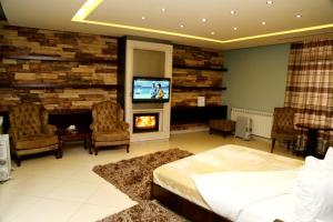 TV a/nebo společenská místnost v ubytování Layali Al Shams Hotel