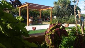 Vonkajšia záhrada v ubytovaní Baglio Cudia Resort