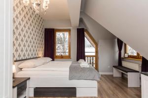 Posteľ alebo postele v izbe v ubytovaní udanypobyt Apartamenty Orkana Park Centrum + 30 fotografií