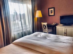 Postel nebo postele na pokoji v ubytování Hotel Vanilla