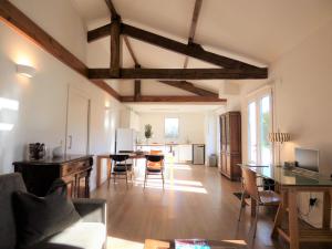 a living room with a table and a dining room at Maison Oyan in Urrugne