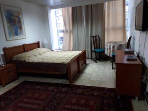 Postel nebo postele na pokoji v ubytování Hotel Rothschild 37