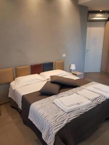 ナポリにあるMaliziusellaの部屋に並んで置かれた2つのベッド