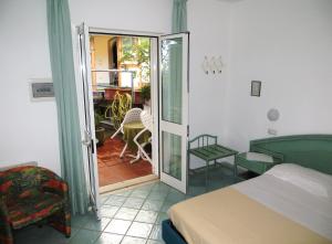 Postel nebo postele na pokoji v ubytování Albergo Villa Mario