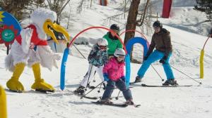 a group of people on skis in the snow at Chalet Ramona in Grächen