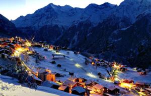 a ski resort in the mountains at night at Chalet Ramona in Grächen