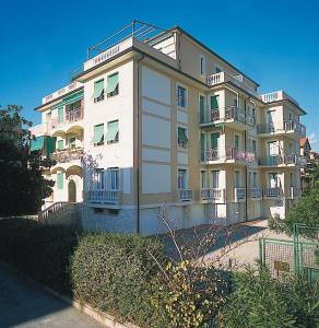 a large white building with balconies on the side of it at Ligure Residence in Borgio Verezzi