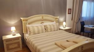 Postel nebo postele na pokoji v ubytování B&B in Arena L' Opera