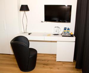 A television and/or entertainment centre at Spa Resort Fonte Alla Lepre