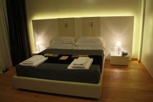 A bed or beds in a room at Spa Resort Fonte Alla Lepre