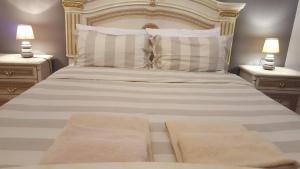 Postel nebo postele na pokoji v ubytování B&B in Arena L' Opera