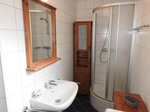 a bathroom with a sink and a shower at ALPENFLAIR Appartment mit Aussicht zum träumen in Turracher Hohe +49 photos