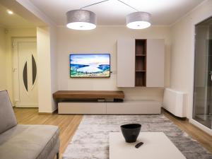 a living room with a couch and a table at Villa Carmen in Opatija