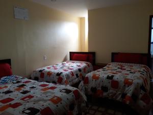 Postel nebo postele na pokoji v ubytování Hotel Navarra