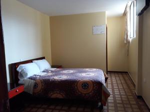 Postel nebo postele na pokoji v ubytování Hotel Navarra