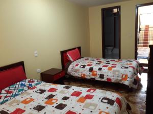 Postel nebo postele na pokoji v ubytování Hotel Navarra
