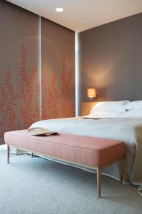 Łóżko lub łóżka w pokoju w obiekcie Das Hotel im Kurhaus Bad Gleichenberg