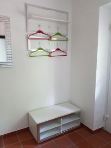 a white closet with hangers on a white wall at Fritzlar Ederauen in Fritzlar