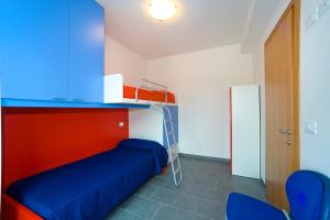 Postel nebo postele na pokoji v ubytování Residence Galleria Gran Madò
