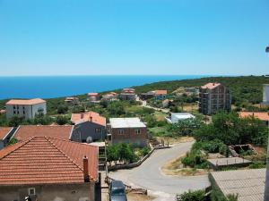 a view of a town with the ocean in the background at Apartments Petrovic in Krimovice